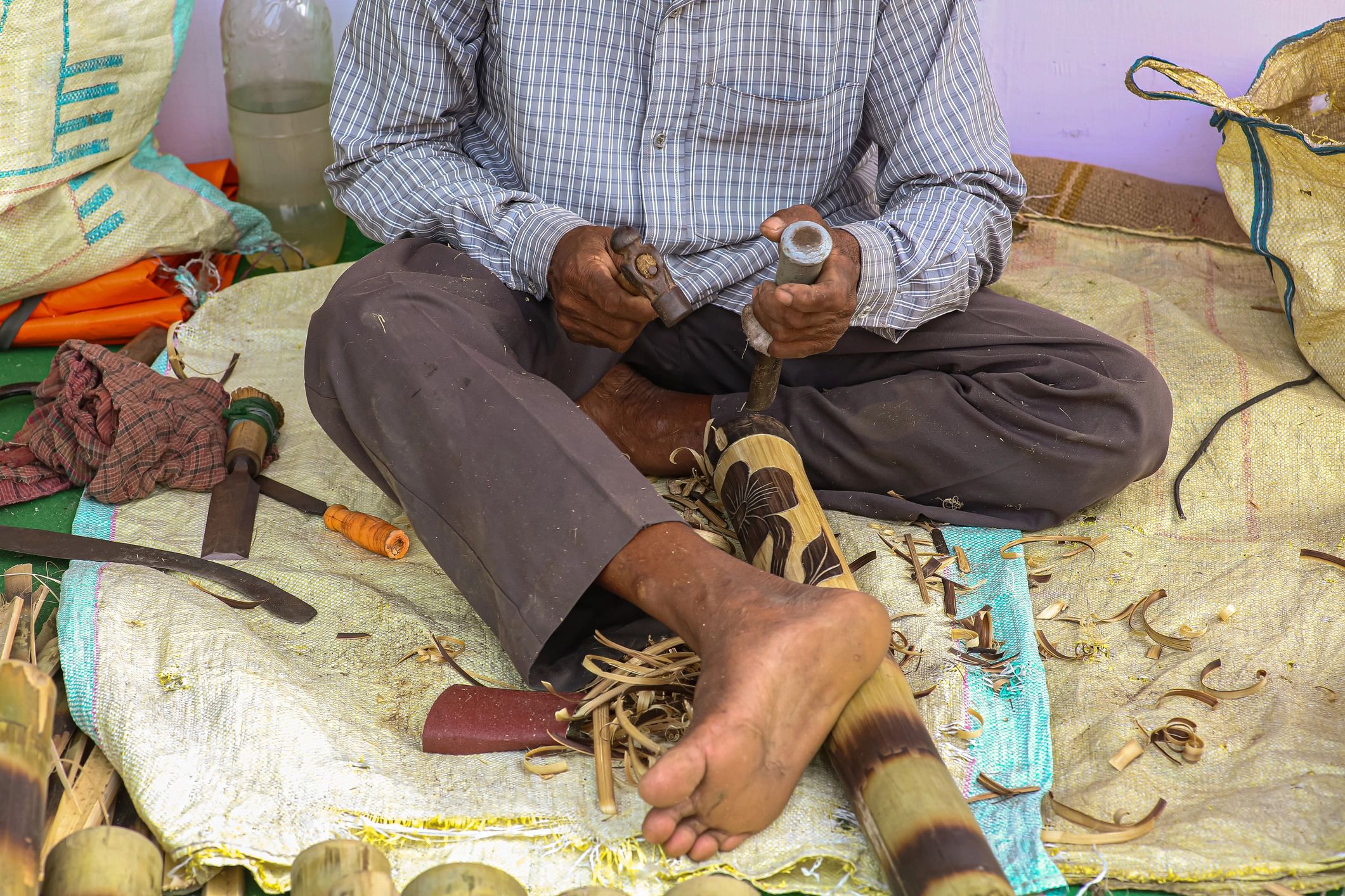 Indian craftsman working with hand tools