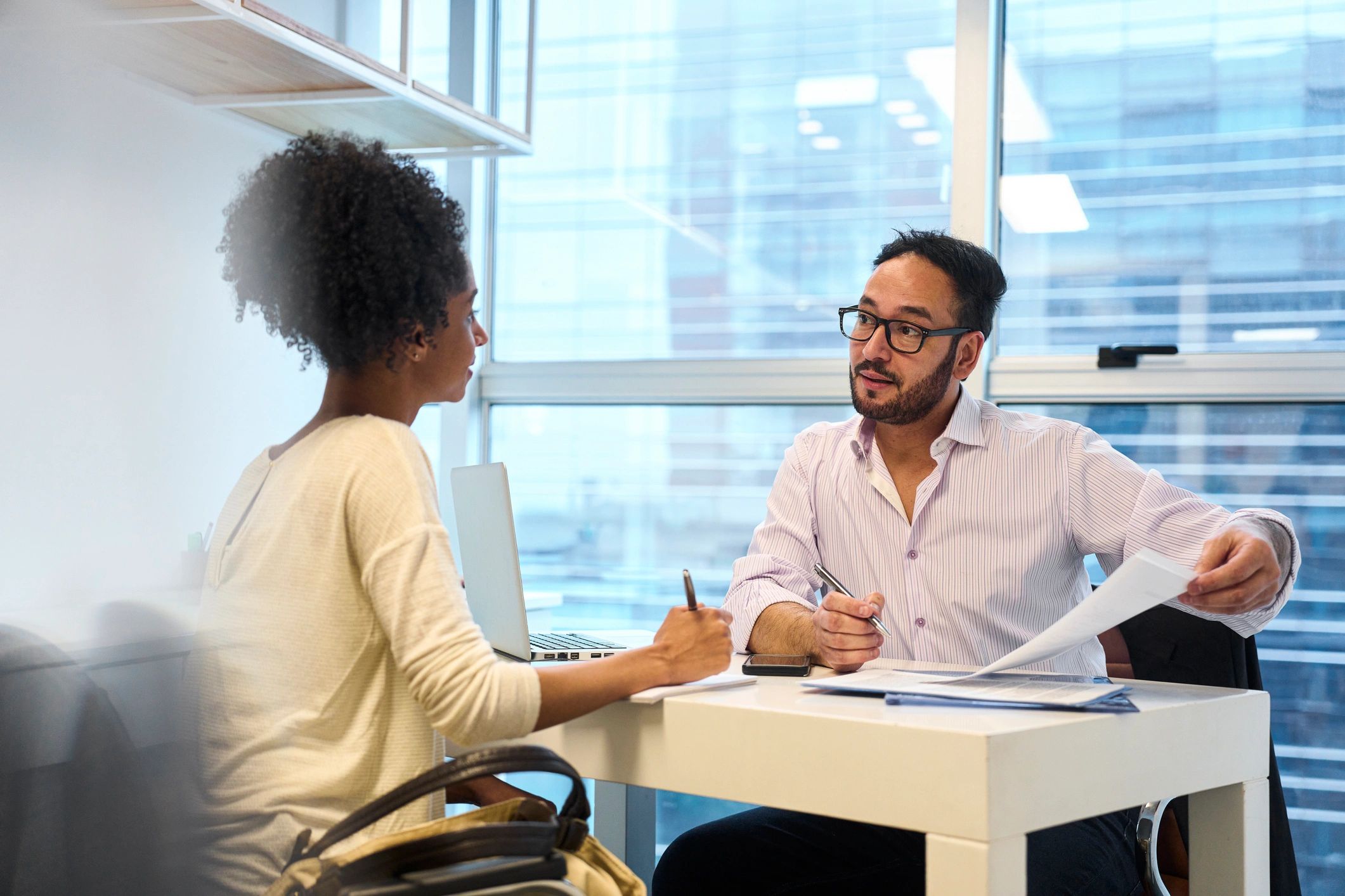 Advisor assisting a client with documents