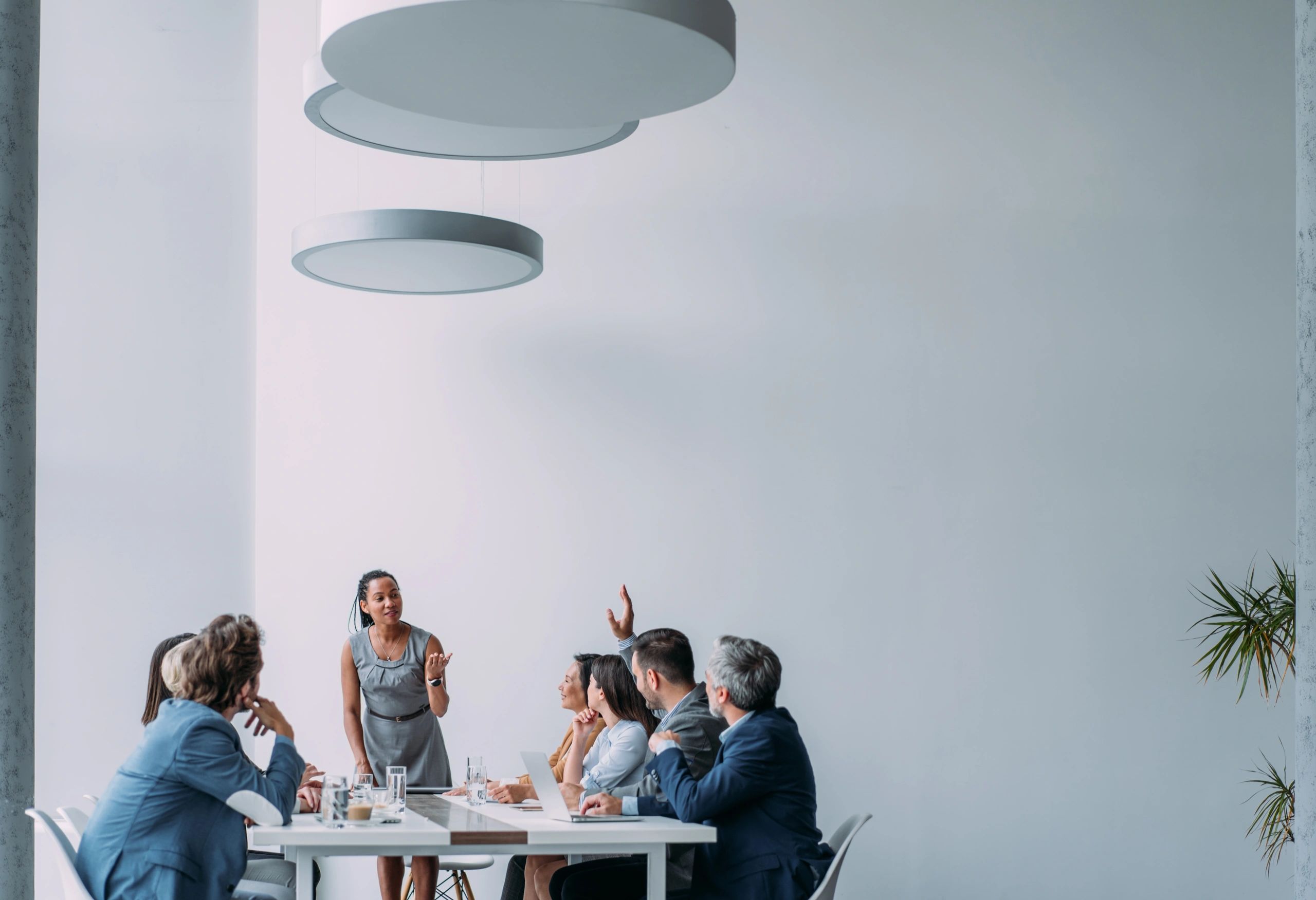 Consultants discussing client strategy in office