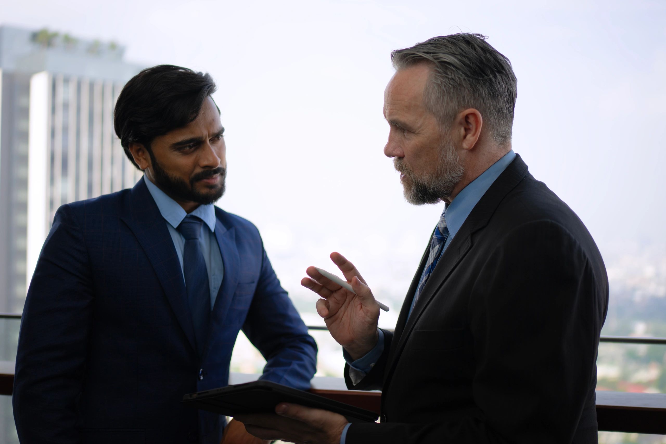 Advisors reviewing documents in an office